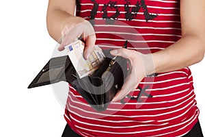 Purse with money in the hands of women, spending money