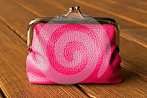 Purse on a wooden table . On wooden background
