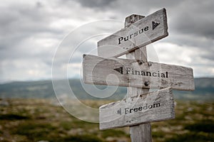 pursue financial freedom signpost outdoors