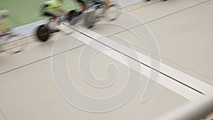Pursuit race on cycling track. Cyclists training riding on velodrome. Bicycle race speed. Cycling in curve. Professional velodrome
