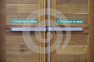 Push bar to open emergency fire exit door