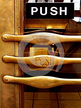 Push brass door handle