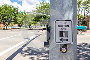 Push button for crosswalk sign ona road in the USA