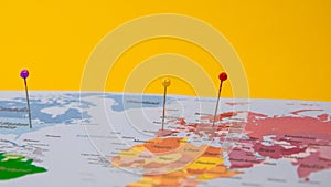 Push pin marked on a map, Locations marked with pins on world map, global communication network, closeup