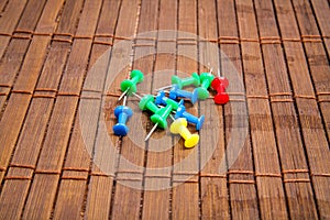 Push pin on wooden board