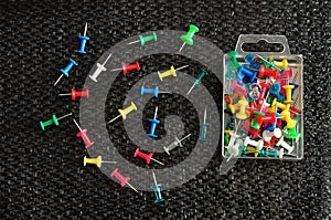 Push pins in a container