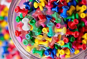 Push Pins A container of push pins in various colors