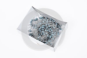 Push pins on white background