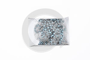 Push pins on white background