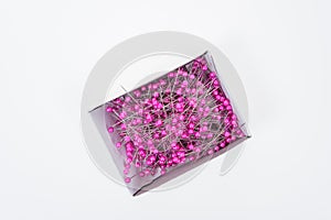 Push pins on white background