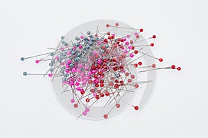 Push pins on white background