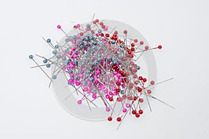 Push pins on white background