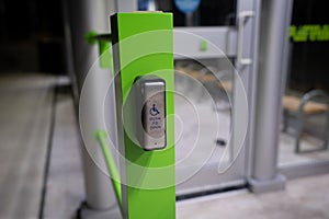 Push to open button for wheelchair users