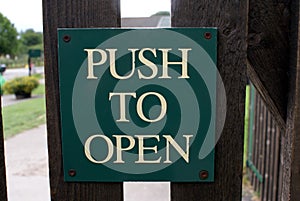 Push to open sign