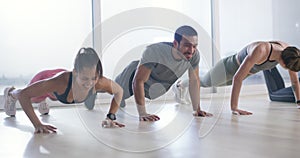 Push ups, running or group of people in gym for fitness workout, body exercise or healthy wellness. Diversity, teamwork