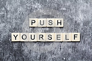 Push yourself motivation formed with plastic tiles