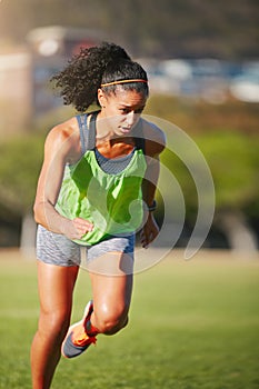 Push yourself, because no one else will. a sporty young woman exercising outdoors.