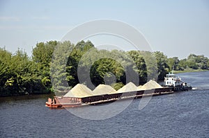 Pusher tug with a barge on the Pripyat River, Belarus.