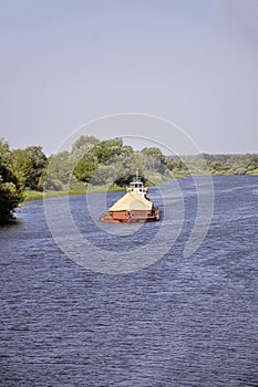 Pusher tug with a barge on the Pripyat River, Belarus.