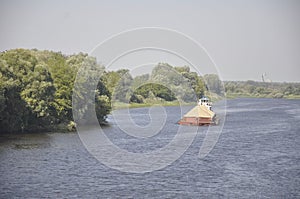 Pusher tug with a barge on the Pripyat River, Belarus.