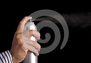 Pushing button on hair spray can