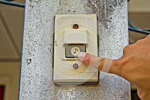 Pushing an electronic doorbell