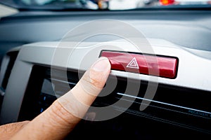 Pushing Red light hazard button on a car console