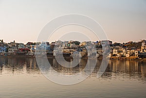 Pushkar. India. Houses reflected in the water. A beautiful lake.