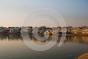 Pushkar. India. Houses reflected in the water. A beautiful lake.