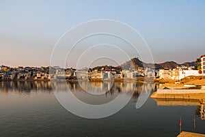 Pushkar. India. Houses reflected in the water. A beautiful lake.