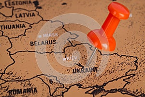 Pushpin red pointing at, Ukraine, europe. MAP photo