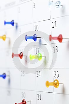 Pushpins on calendar