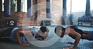 Pushups, support and a black couple with fitness at the gym for teamwork, workout or training challenge. Happy, together