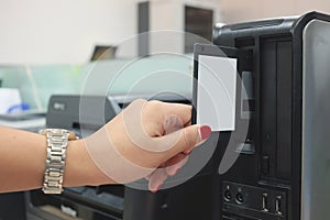 Put a floppy disk into the computer