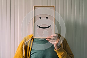 Put a happy optimistic face on, happiness and cheerful emotions photo