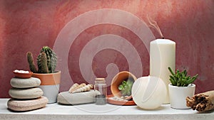 Put out candle smoke on decorative white shelf with succulent plant and cactus against old brick color wall