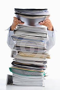 Put paper into high pile paperwork photo