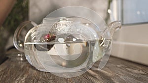 Put tea in to boiling water poured to the glass teapot