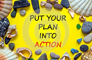 Put your plan into action symbol. Concept words Put your plan into action on beautiful yellow background. Sea stones and seashells