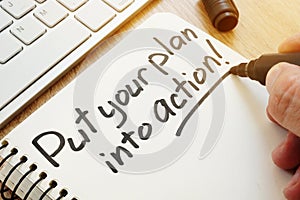 Put your plan into action written by hand. Business motivation.