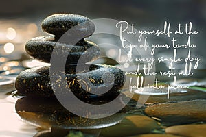 Put yourself at the top of your to do list quote text with zen stones background. Inspirational concept