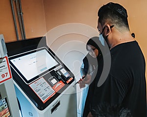 putrajaya, Malaysia - June 8, 2022 Paying for parking using QR Code in IOI City Mall. Modern technology