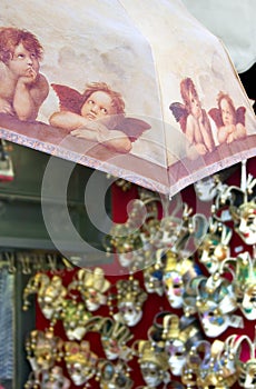 Putti souvenir umbrella and Venice masks