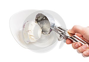 putting ball of ice cream in bowl by disher scoop