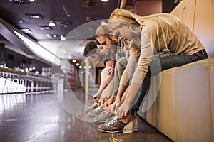 Putting on bowling shoes