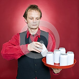 Putting cans on a tray