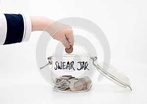 Putting a coin into a swear jar