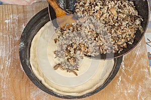 Putting filling on raw dough