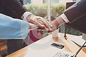 Putting hands of business office partnership