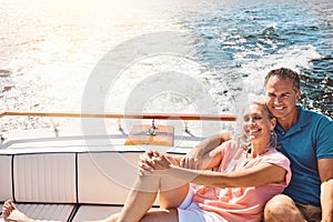 Putting life on cruise control. a mature couple enjoying a relaxing boat ride.